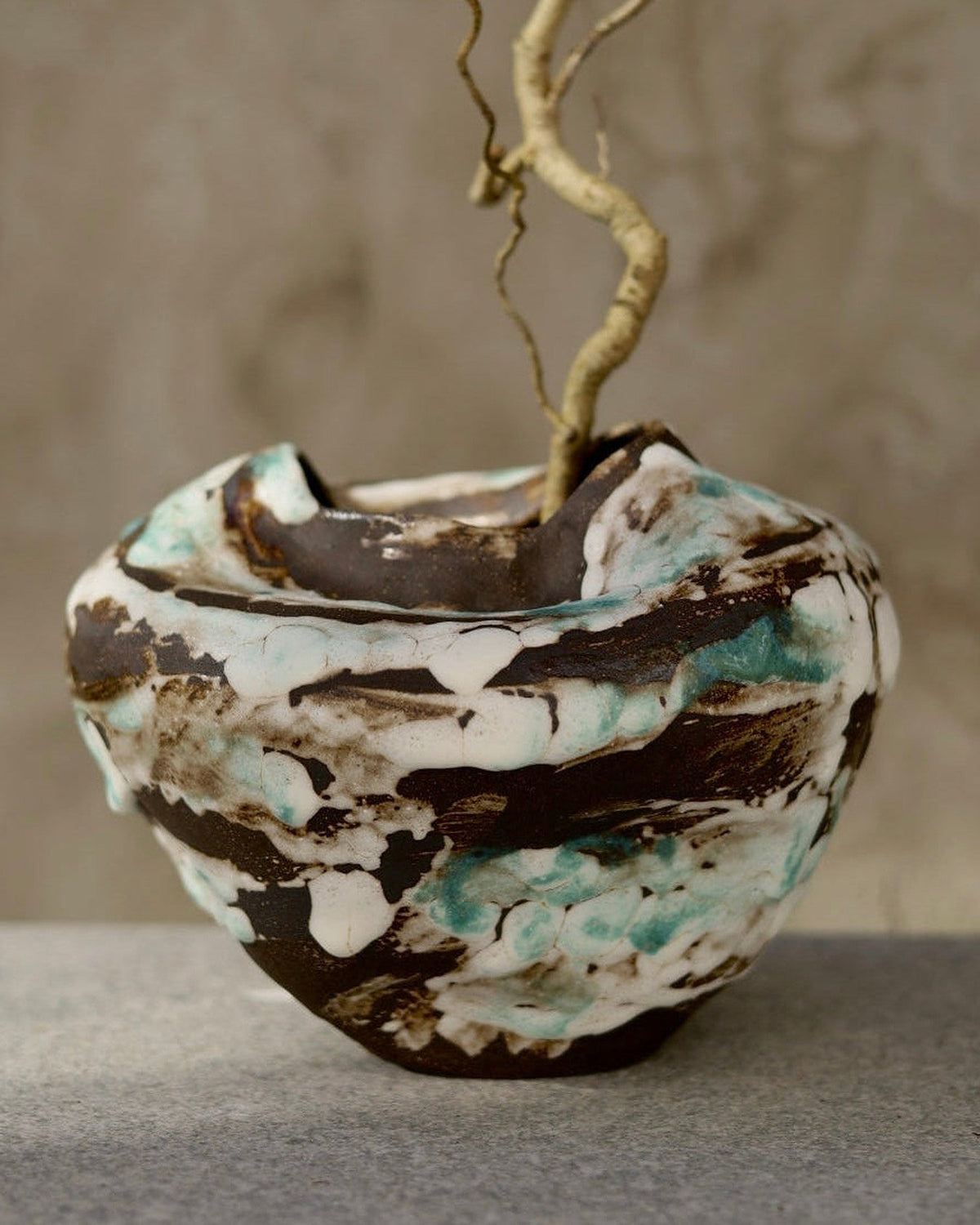 Bolo vessel styled with a curly branch (branch not included)